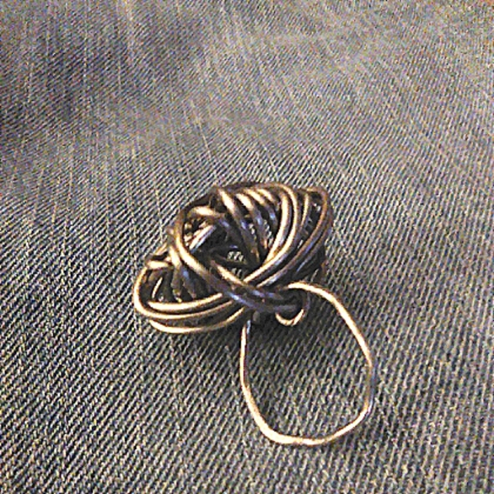 MMBM (man made by me) silver tone, adjustable ring. Size 7/8/9.